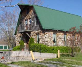 The old rock barn, home of Jim's Old Fashion Service in Bella Vista Arkansas.
